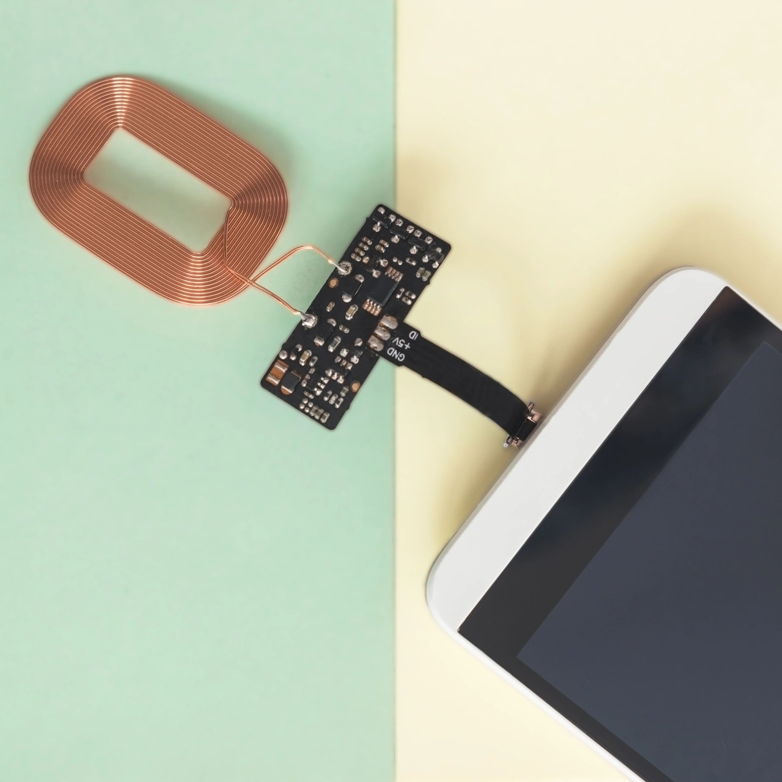 Wireless mobile phone charger on a colorful background